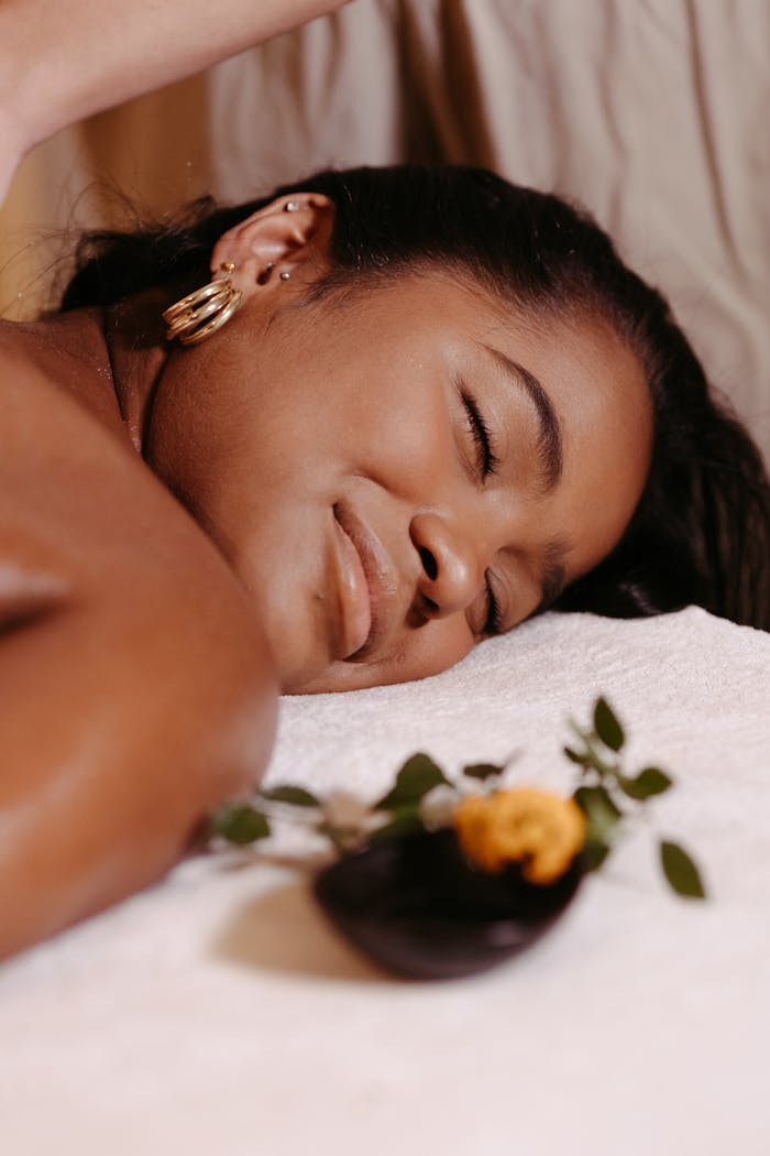 services-01 Woman enjoying a relaxing massage at a spa with serene ambiance and aromatherapy.